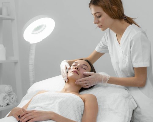 beautician-with-female-client-salon-face-care-routine